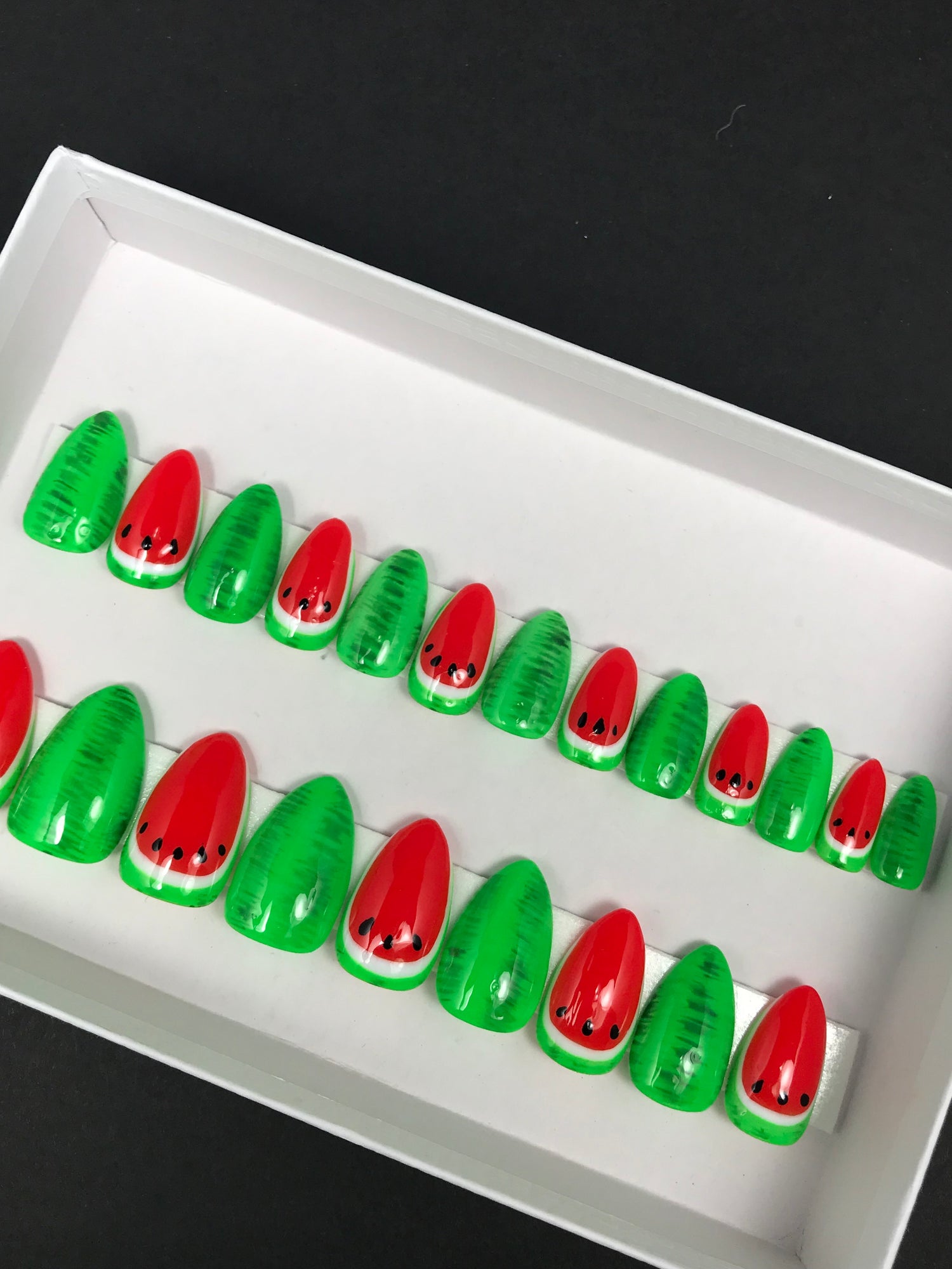 bright watermelon press on nails in the short almond shape